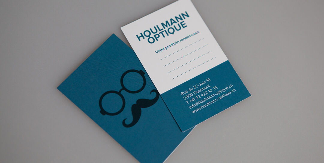 Carte de visite Houlmann optique avec des informations sur l'adresse et numéro de téléphone.