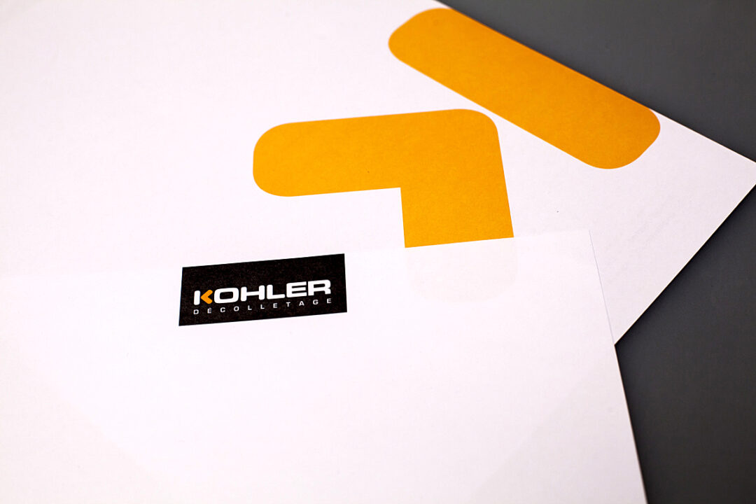 Feuille de papier avec un logo Kohler Décolletage en haut à droite de la feuille.